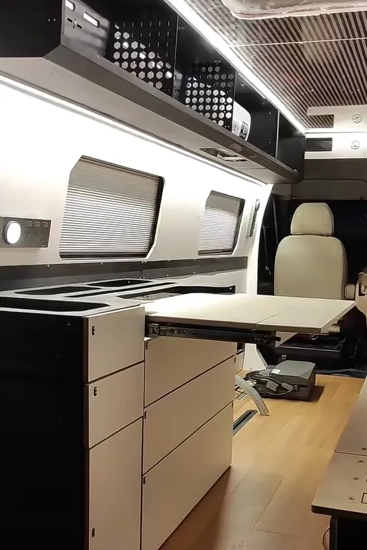 Surfboard storage inside VW Transporter next to bed